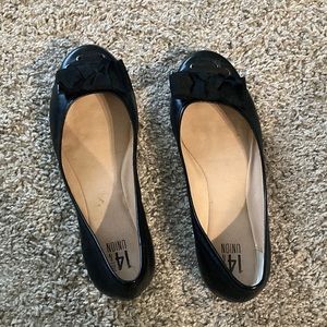 Black leather flats